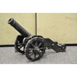 A large cast iron model of a cannon,