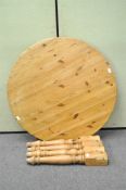 A pine circular kitchen table,