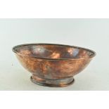 A copper footed bowl,