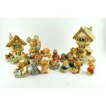 A collection of Pendelfin rabbit figures and houses,