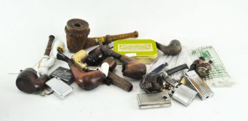 Assorted smoking related items including lighters and pipes