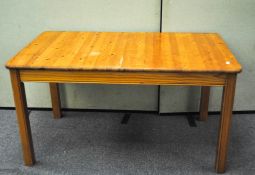 A pine kitchen table, 74cm high, 84cm wide,