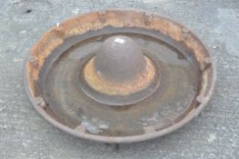 A cast iron Mexican pig hat feeder,