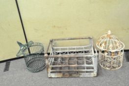 Two metal bird cages and a metal bottle crate