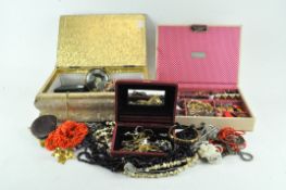 Three boxes of assorted costume jewellery including necklaces,