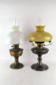 Two brass oil lamps, with original glass shades, one made in Sweden,