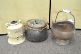A copper coal scuttle with ceramic handles,