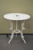 A Victorian style white painted metal patio table,