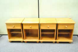 A set of four vintage pine bedside cabinets,