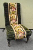 A Victorian Aesthetic style nursing chair with ebonised and gilt legs,