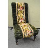 A Victorian Aesthetic style nursing chair with ebonised and gilt legs,