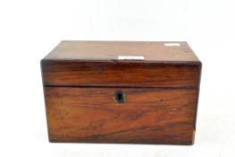 A 19th century tea caddy, possibly rosewood,