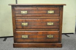 A three drawer oak chest of drawers,