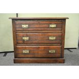 A three drawer oak chest of drawers,