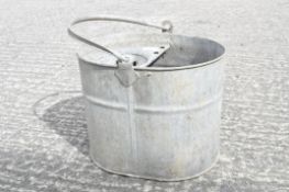 A galvanised mop bucket