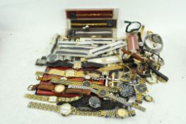 A collection of assorted wrist watches and straps