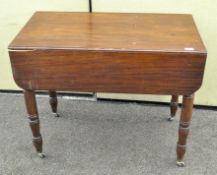 A Victorian mahogany Pembroke table, on turned baluster legs,