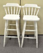 A pair of white painted bar chairs,