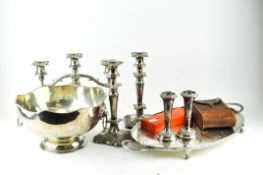 A collection of silver plated wares, including a pair of candlesticks,