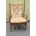 A Parker Knoll armchair, with button upholstery,