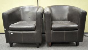A pair of brown upholstered tub chairs,