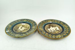 An Austrian Majolica style charger with dwarves decoration and another similar with children