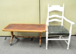 A pine coffee table with inlaid leather top and ladder back chair,