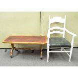 A pine coffee table with inlaid leather top and ladder back chair,