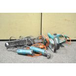 An electric chain saw and two Makita electric tools