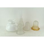 Four frosted and milk glass oil lamp shades and a frosted flue,