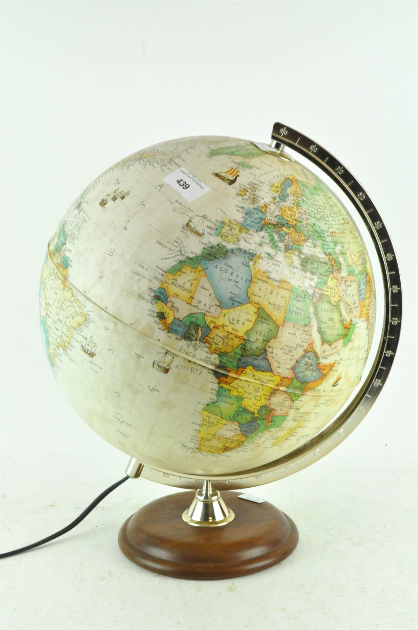 A modern table lamp in the form of a globe,