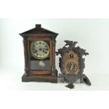 A mahogany cased mantel clock with a temple pediment,