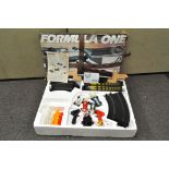 A Scalextrix Formula 1 set in original box, including four cars,