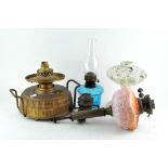 A collection of oil lamps and parts,