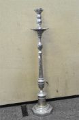 A large chrome floor standing candlestick