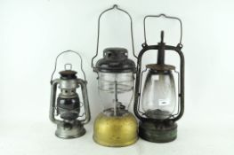 A vintage Tilley style lamp and two others,