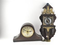 A wall clock with finial adorning the top depicting Atlas,