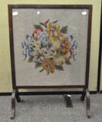 A mahogany and needlework fire screen, 70cm x 52cm.