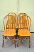 A set of four Oak Windsor style kitchen chairs with X stretchers