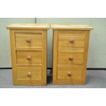 A pair of oak bedside chests of three drawers,
