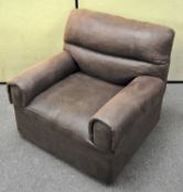 A brown leather upholstered single seat sofa armchair,