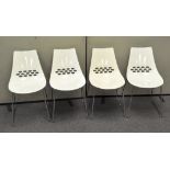 A set of four contemporary Calligaris Jam Jar white plastic chairs, raised on steel wire legs,