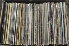 A large collection of assorted vinyl records, mostly rock,