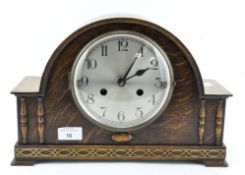 A German (Kienzle) chiming clock, in oak arched rectangular case,