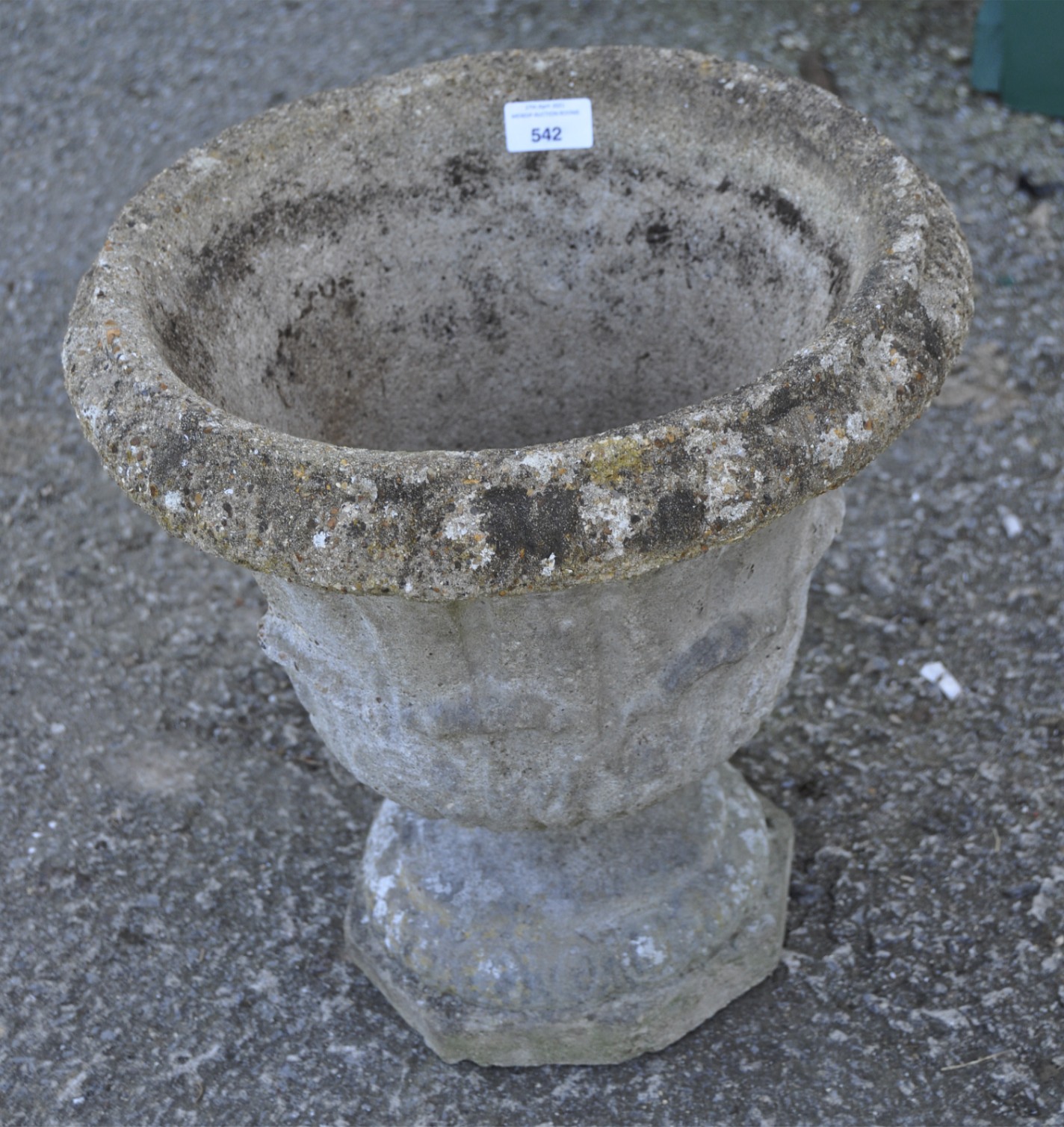 A reconstituted stone urn,