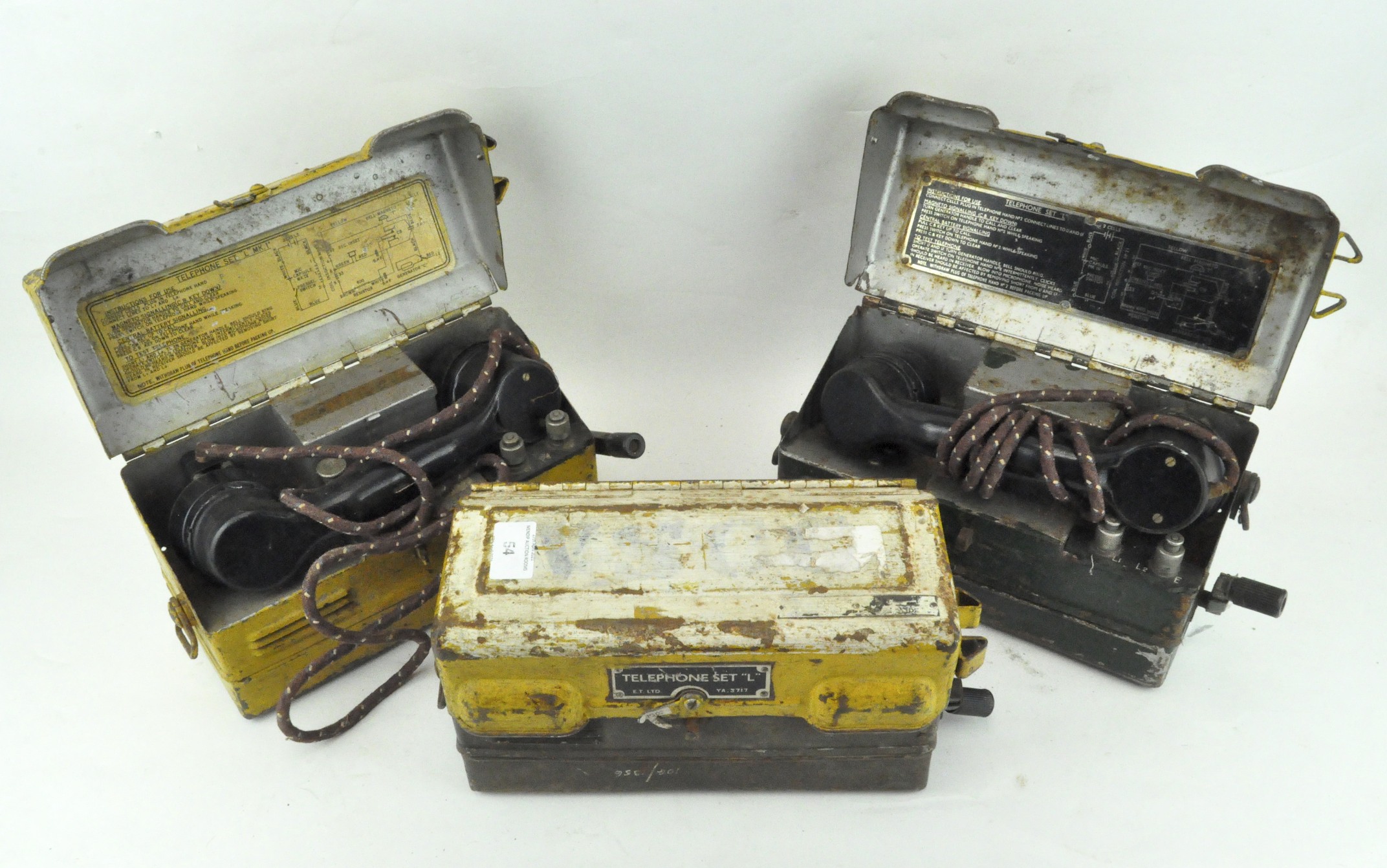 Three early Field Telephone Sets 'L', each with black bakelite receiver, in painted metal case,