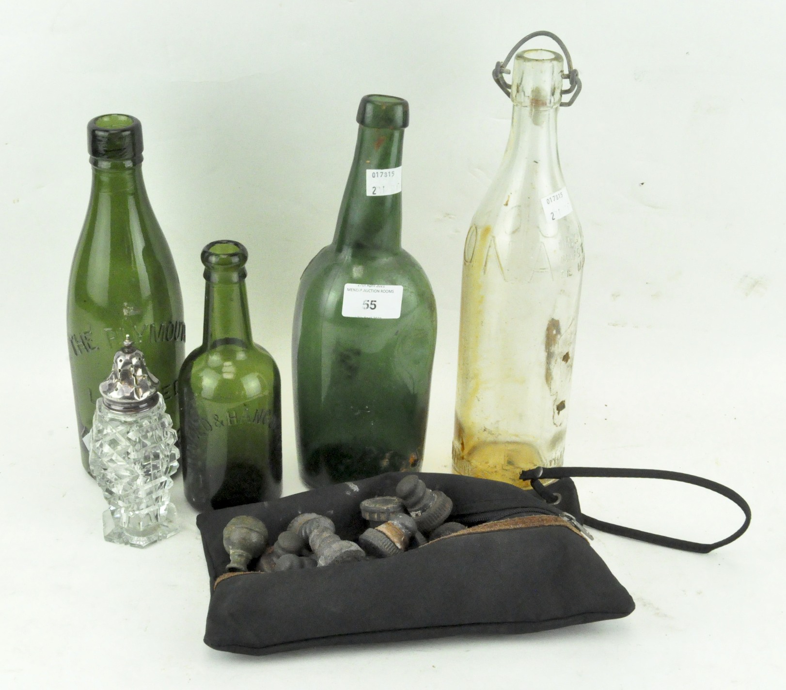 Four glass bottles, one bearing the date 1877 'W and H'; another named for Plymouth Brewery,