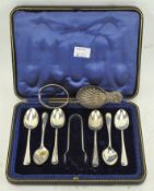 An Edwardian cased set of six silver teaspoons with matching sugar tongs,