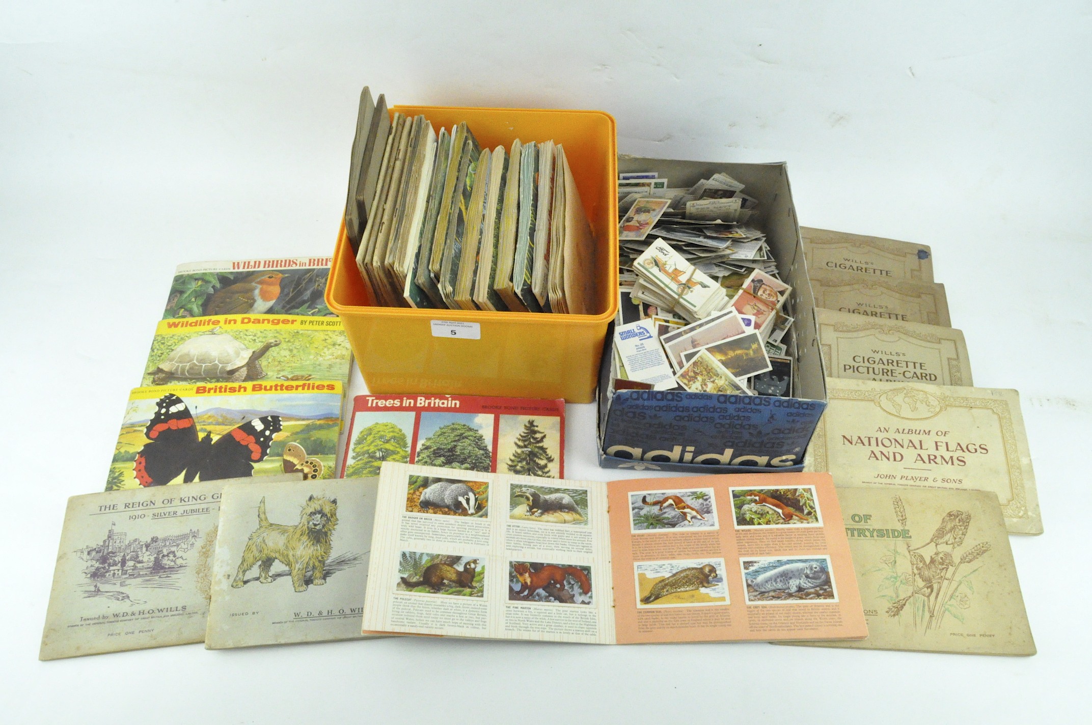 A group of various cigarette and tea cards, some in albums, including Wills,
