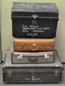 A group of four vintage travelling trunks and a metal riveted trunk,